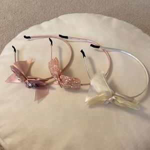 Lot of 3 Girl’s Headband. 2 Peach, 1 Lt Yellow. All w/ Ornament. New w/o Tags.